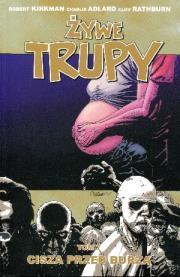 Żywe trupy tom 7 Cisza przed burzą. Autor: Kirkman Robert, Adlard Charlie, Rathburn Cliff. Dadada.pl Okładka książki Żywe trupy tom 7 Cisza przed burzą